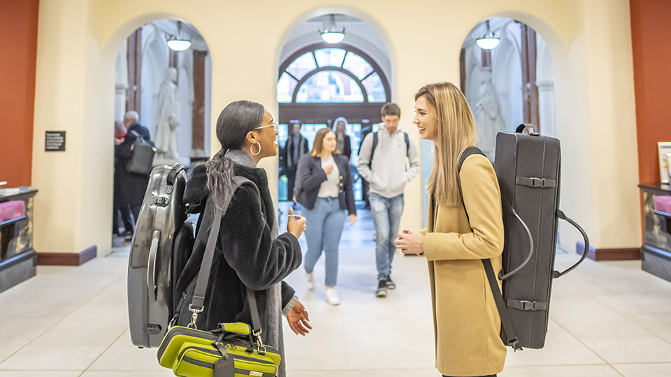 Students chatting in the RCM's entrance hall